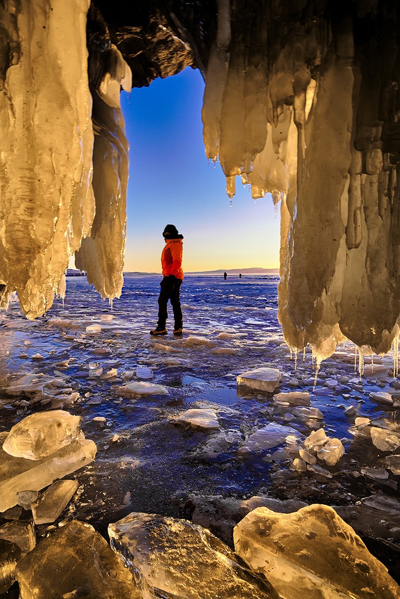 A sunset shot from inside an ice cave.